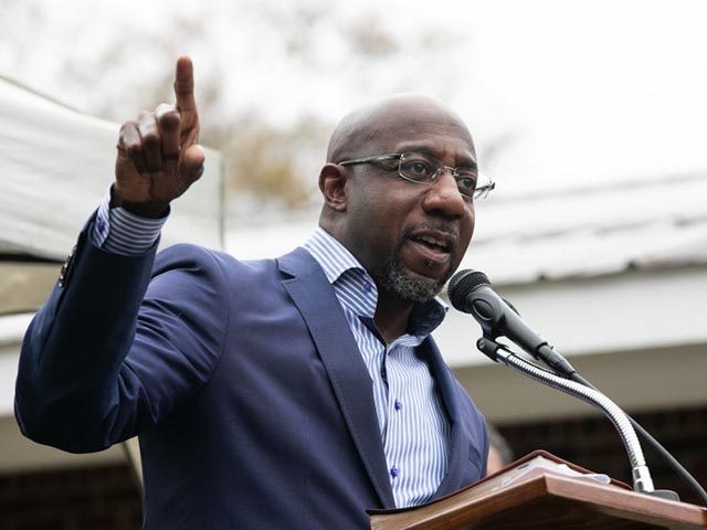 COLUMBUS, GA - DECEMBER 13: Democratic U.S. Senate candidate Raphael Warnock speaks to church members during a drive-up worship service at St. James Missionary Baptist Church on December 13, 2020 in Columbus, Georgia. Warnock is facing incumbent Sen. Kelly Loeffler (R-GA) in a runoff election that will take place on …