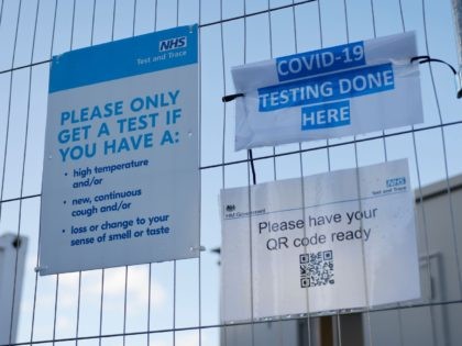 A sign is pictured on a fence outside a novel coronavirus COVID-19 walk-in testing centre