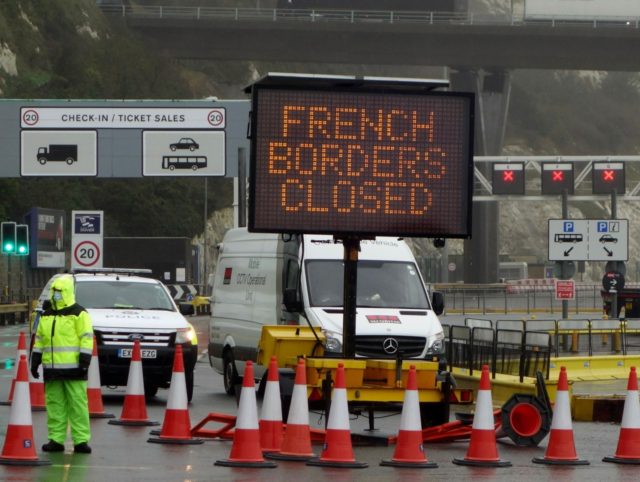 A sign alerts customers that the "French Borders are Closed" at the entrance to