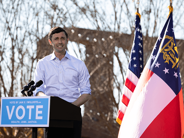 Georgia Democratic Senate candidate Jon Ossoff addresses the crowd during a drive-in rally at Bibb Mill Event Center on December 21, 2020 in Columbus, Georgia. The rally was attended by Vice President-elect Kamala Harris and comes ahead of a crucial runoff election for candidates Rev. Raphael Warnock and Jon Ossoff …
