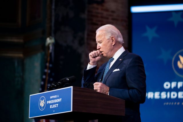 US President-Elect Joe Biden coughs while delivering remarks, before the holiday, at The Queen in Wilmington, Delaware on December 22, 2020. (Photo by Alex Edelman / AFP) (Photo by ALEX EDELMAN/AFP via Getty Images)