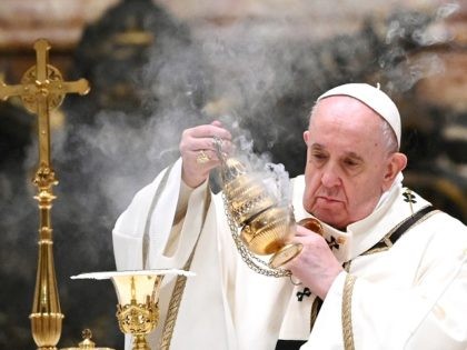Pope Francis holds a thurible as he leads a Christmas Eve mass to mark the nativity of Jesus Christ on December 24, 2020, at St Peter's basilica in the Vatican, amidst the Covid-19 pandemic, caused by the novel coronavirus. (Photo by Vincenzo PINTO / POOL / AFP) (Photo by VINCENZO …