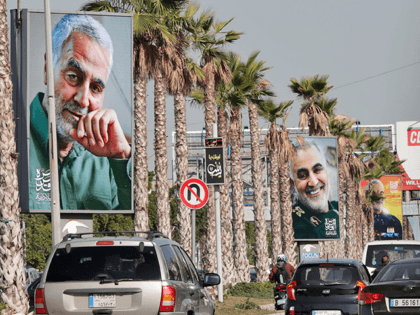 The highway leading the Lebanese capital Beirut to the southern areas of the city is pictured ahead of the first anniversary of the killing of Iranian Revolutionary Guards commander Qasem Soleimani (portrait), on December 31, 2020 in Beirut. - On January 3, Iraq will mark a year since a US …