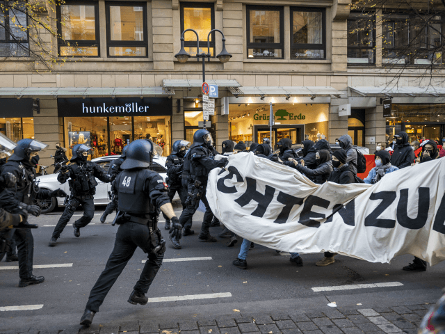 FRANKFURT AM MAIN, GERMANY - NOVEMBER 14: Police clash with left-wing antifa counter-demonstrators protesting against a demonstration of the Querdenker movement on November 14, 2020 in Frankfurt, Germany. Some hundreds of demonstrators gather to protest against coronavirus lockdown restrictions Police, who have in the past looked on without strongly intervening …