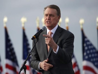 SAVANNAH, GEORGIA - DECEMBER 04: Sen. David Perdue (R-GA) attends a rally with Vice President Mike Pence in support of both he and Sen. Kelly Loeffler (R-GA) on December 04, 2020 in Savannah, Georgia. The Defend the Majority Rally with the senators comes ahead of a crucial runoff election for …