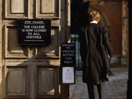 ETON, ENGLAND - MARCH 1: Pupil at Eton College hurries between lessons, March 1, 2004 wearing the school uniform of tailcoats and starched collars, in Eton, England. Dozens of the country's foremost independent schools are facing heavy fines if a government inquiry finds them guilty of operating a fee-fixing cartel. …