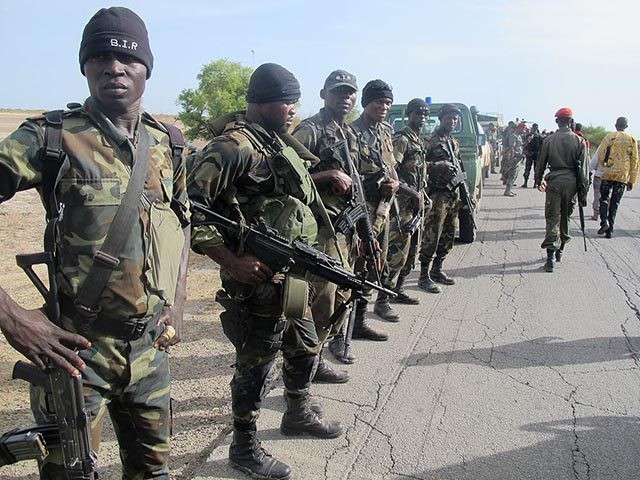 This photo taken on June 17, 2014 in Dabanga, northern Cameroon, shows Cameroon's army soldiers deploying as part of a reinforcement of its military forces against Nigerian Islamist group Boko Haram. Boko Haram, which in April 2014 kidnapped more than 200 schoolgirls in northeast Nigeria to international condemnation, has been …