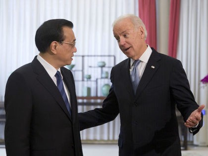 BEIJING, CHINA - DECEMBER 05: U.S. Vice President Joe Biden (R), chats with Chinese Premier Li Keqiang before heading to their meeting at the Zhongnanhai diplomatic compound on December 5, 2013 in Beijing, China. U.S Vice President Joe Biden is on an official visit to China from December 4 to …