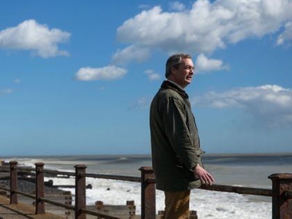 DOVER, ENGLAND - MARCH 31: Nigel Farage, leader of the U.K. Independence Party (UKIP) poses along a footpath under the White Cliffs of Dover on March 31, 2015 in Dover, England. UKIP unveiled their latest election political campaign poster today, aimed at issues of reducing immigration. (Photo by Dan Kitwood/Getty …