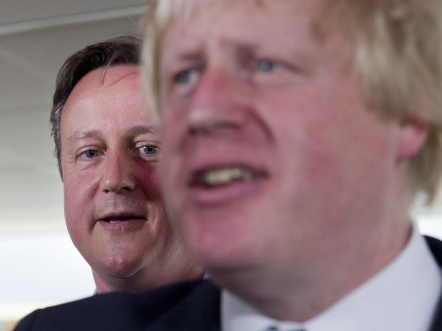 London Mayor Boris Johnson (R) and British Prime Minister David Cameron speak at a Conserv