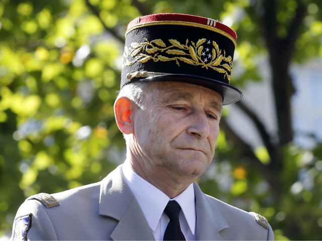 Chief of the Defense Staff, French Army General Pierre de Villiers arrives aboard a command car during the annual Bastille Day military parade on the Champs-Elysees avenue in Paris on July 14, 2017. - The parade on Paris's Champs-Elysees will commemorate the centenary of the US entering WWI and will …