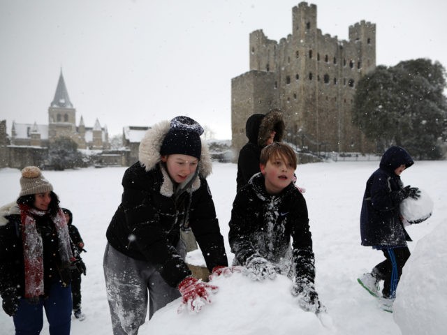 ROCHESTER, UNITED KINGDOM - FEBRUARY 27: Children roll snowmen in the Castle grounds on February 27, 2018 in Rochester, United Kingdom. Freezing weather conditions dubbed the 'Beast from the East' brings snow and sub-zero temperatures to the UK. (Photo by Dan Kitwood/Getty Images)