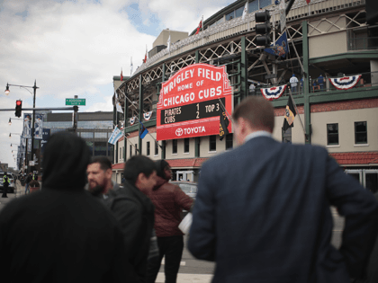 Ticket sellers try to unload the last of their discounted game tickets across from Wrigley Field during the Chicago Cubs home opener on April 10, 2018 in Chicago, Illinois. The game against the Pittsburgh Pirates was originally scheduled for yesterday but was delayed due to snow. (Photo by Scott Olson/Getty …