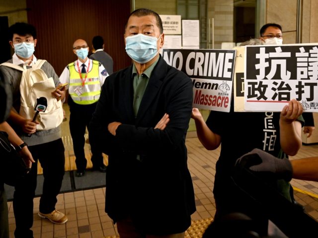 Pro-democracy media tycoon Jimmy Lai (C), facing charges of inciting others to participate