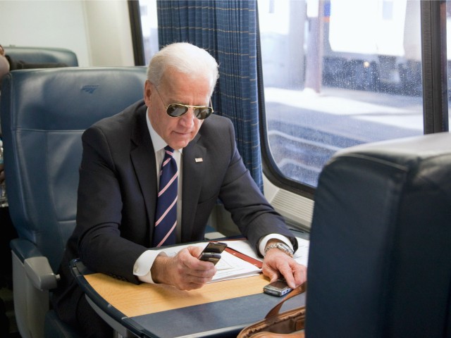 Vice President Joe Biden makes a phone call on a train at Union Station in Washington, Tuesday, Feb. 8, 2011, as he headed to an event in Philadelphia to tout plans to improve the nation's infrastructure. (AP Photo/Evan Vucci)
