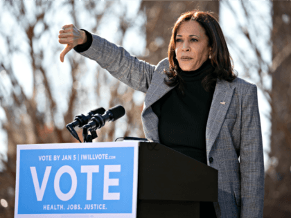 COLUMBUS, GA - DECEMBER 21: Vice President-elect Kamala Harris gives a thumbs down while speaking in support of Georgia Democratic Senate candidates Rev. Raphael Warnock and Jon Ossoff during a drive-in rally at Bibb Mill Event Center on December 21, 2020 in Columbus, Georgia. The visit by Vice President-elect Harris …