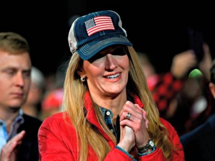 Georgia Republican Senator Kelly Loeffler reacts during a rally with US President Donald T