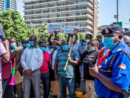 Nurses and Clinical Officers gather in front of Kenya´s Parliament during a march in Nairobi on December 14, 2020. Nurses and Clinical Officers went on strike on December 07, 2020 demanding safer working conditions after more than 60 health workers died of COVID-19 coronavirus since the beginning on the pandemic. …