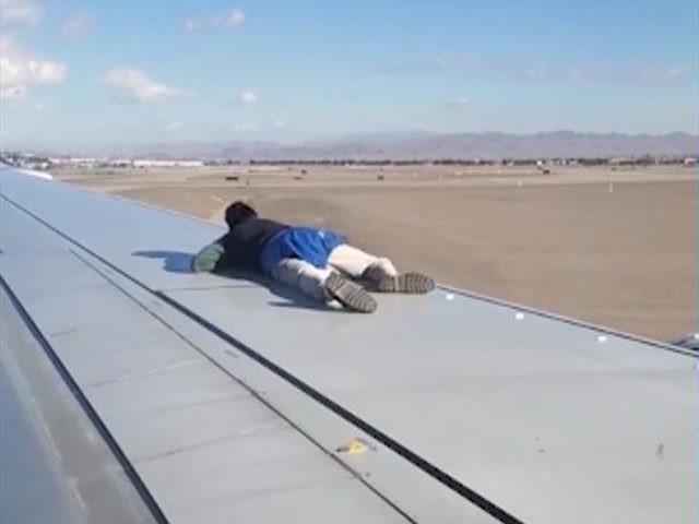 VIDEO: Man in Custody After Climbing Aircraft Wing