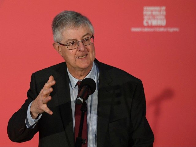 Welsh Labour leader Mark Drakeford speaks at a rally as Britain's opposition Labour party leader Jeremy Corbyn campaigns for the general election in Swansea, south Wales on December 7, 2019. - Britain will go to the polls on December 12, 2019 to vote in a pre-Christmas general election. (Photo by …