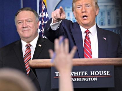 WASHINGTON, DC - MARCH 20: U.S. President Donald Trump takes questions as Secretary of State Mike Pompeo looks on during a news briefing on the latest development of the coronavirus outbreak in the U.S. at the James Brady Press Briefing Room at the White House March 20, 2020 in Washington, …