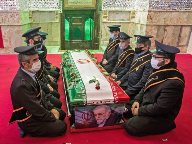OPSHOT - Members of Iranian forces pray around the coffin of slain nuclear scientist Mohsen Fakhrizadeh during the burial ceremony at Imamzadeh Saleh shrine in northern Tehran, on November 30, 2020. - Iran said Israel and an exiled opposition group used new and "complex" methods to assassinate its leading nuclear …