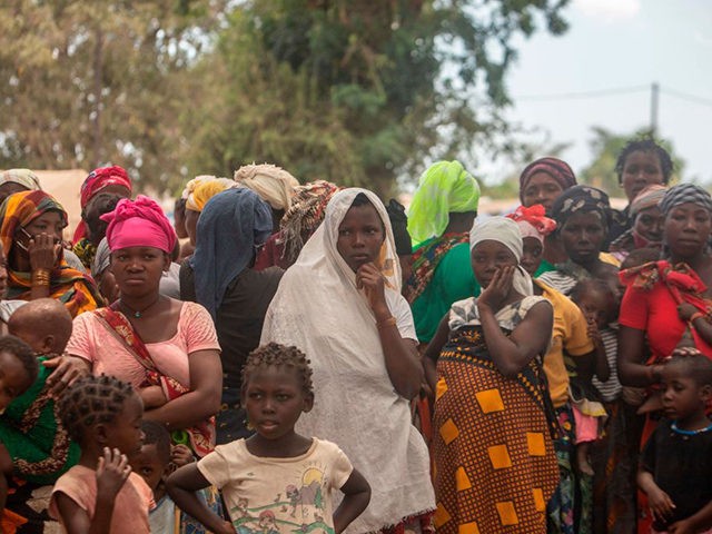 Displaced women attend a meeting on December 11, 2020, at the Centro Agrrio de Napala where hundreds of displaced arrived in recent months are sheltered after fleeing attacks by armed insurgents in different areas of the province of Cabo Delgado, in northern Mozambique. (Alfredo Zuniga/AFP via Getty Images)