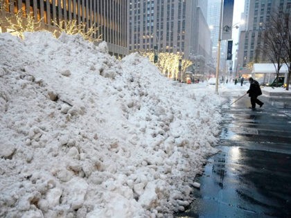 Mounds of snow are seen on Sixth Avenue on December 17, 2020 in New York, the morning after a powerful winter storm hit the US northeastern states. - A major snowstorm hit the US east coast during Thursday's early hours, creating extra challenges in the midst of a coronavirus pandemic …