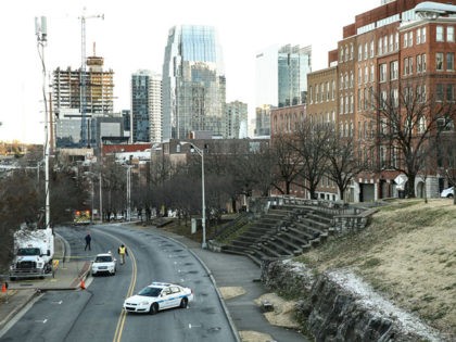 NASHVILLE, TENNESSEE - DECEMBER 25: Police close off an area damaged by an explosion on Ch