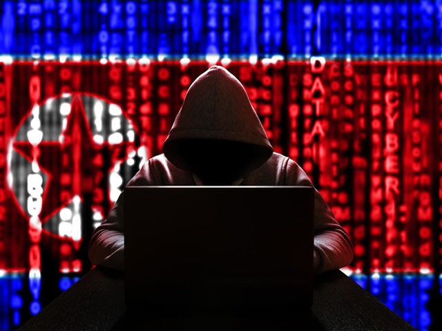 Cyber threat from North Korea. North Korean hacker at the computer, on a background of binary code, the colors of the flag of the DPRK. DDoS attack