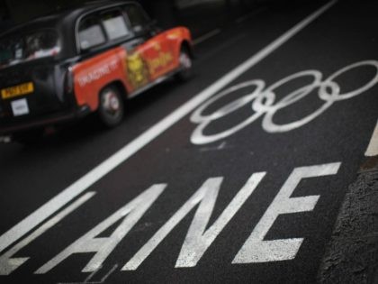 LONDON, ENGLAND - JULY 16: A taxi drives past an Olympic Lane marking on the Embankment on July 16, 2012 in London, England. The first Olympic lanes were due to be closed to all but Olympic traffic in London today, though many have stayed open. (Photo by Dan Kitwood/Getty Images)