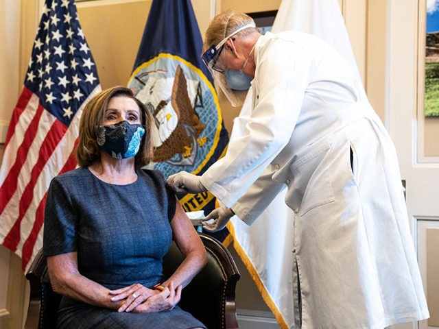 WASHINGTON, DC - DECEMBER 18: Brian Monahan, the Attending Physician of the United States Congress, administers the Pfizer-BioNTech COVID-19 vaccine to House Speaker Nancy Pelosi (D-CA) in the U.S. Capitol Building on December 18, 2020 in Washington, DC. (Photo by Anna Moneymaker-Pool/Getty Images)