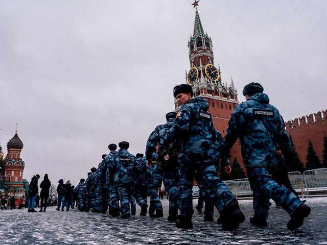 Servicemen of the Russian National Guard patrol along the Red Square in Moscow, on December 30, 2019, as the Kremlin's Spasskaya Tower is seen in the background. - A suspect detained for planning an attack in Saint Petersburg during New Year's festivities had pledged allegiance to the Islamic State group, Russia's FSB security service said on December 30. The Russian president on December 29 thanked US President Donald Trump for intelligence that helped foil the attack. (Photo by Dimitar DILKOFF / AFP) (Photo by DIMITAR DILKOFF/AFP via Getty Images)