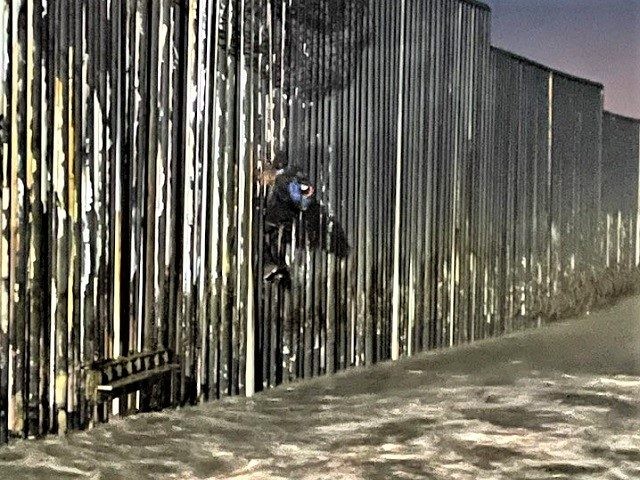Border Patrol agents rescue a Mexican national after he became stuck on the border wall. P