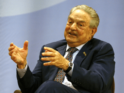 Billionaire financier George Soros speaks during a forum at Hong …