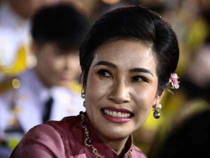 Royal noble consort Sineenat Bilaskalayani, also known as Sineenat Wongvajirapakdi, smiles as Thailand's King Maha Vajiralongkorn and Queen Suthida greet royalist supporters outside the Grand Palace in Bangkok on November 1, 2020 after a religious ceremony at a Buddhist temple inside the palace. (Photo by Jack TAYLOR / AFP) (Photo …