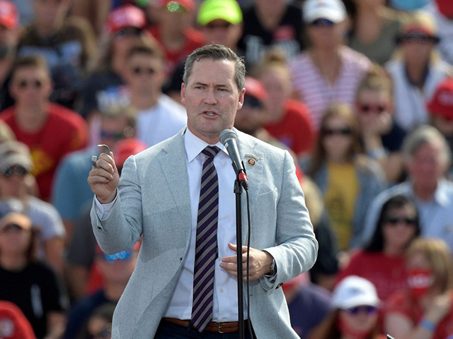 In this Friday, Oct. 16, 2020 file photo, Rep. Michael Waltz, R-Fla., speaks before President Donald Trump during a campaign rally at the Ocala International Airport in Ocala, Fla. A Florida newspaper apologized Friday, Dec. 11, 2020 for endorsing the re-election of a Republican congressman who now supports a lawsuit …