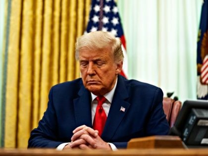 WASHINGTON, DC - AUGUST 28: U.S. President Donald Trump participates in a prayer during an event in the Oval Office of the White House August 28, 2020 in Washington, DC. President Trump has officially pardoned former federal prisoner Alice Johnson, who was sentenced to life for cocaine trafficking in 1997 …