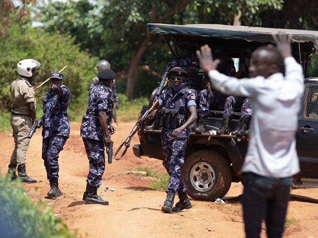 JINJA, UGANDA - DECEMBER 01: Police fire live rounds just outside a medical center where c