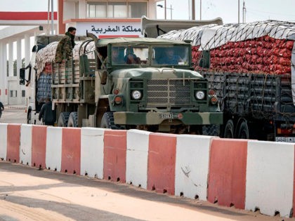 A Moroccan army vehicles drives in Guerguerat, located in the Western Sahara, on November 26, 2020, after the intervention of the royal Moroccan armed forces in the area. - Morocco in early November accused the Polisario Front of blocking the key highway for trade with the rest of Africa, and …