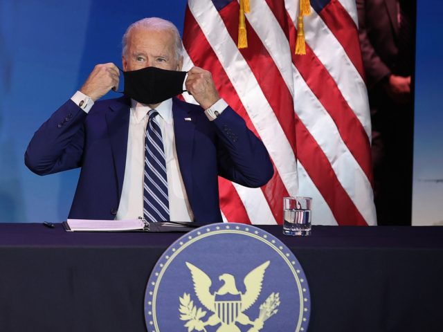 WILMINGTON, DELAWARE - DECEMBER 09: U.S. President-elect Joe Biden (R) replaces his face mask after introducing U.S. Army (retired) General Lloyd Austin as his choice to be Secretary of the Department of Defense at the Queen Theater December 09, 2020 in Wilmington, Delaware. The only African-American to have headed U.S. …
