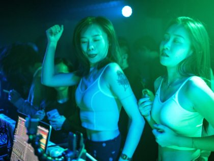 WUHAN, CHINA - SEPTEMBER 18: (CHINA OUT) People dance inside the disco bar on September 18