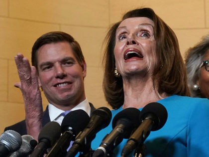 WASHINGTON, DC - NOVEMBER 28: U.S. House Minority Leader Rep. Nancy Pelosi (D-CA) (2nd L) speaks to members of the media as (L-R) Rep. Eric Swalwell (D-CA), Rep. Joyce Beatty (D-OH), Rep. Kathy Castor (D-FL) listen at the lobby of Longworth House Office Building November 28, 2018 in Washington, DC. …