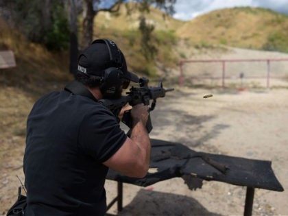 Rabbi Raziel Cohen, aka "Tactical Rabbi", shoots an AR-15 style semi-automatic rifle durin