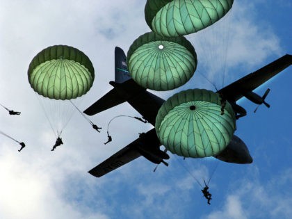 The Army 82nd Airborne Division, from Fort Bragg, N.C., performs a mass jump with 120 memb
