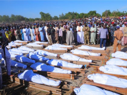 People attend a funeral for those killed by suspected Boko Haram militants in Zaabarmar, Nigeria, Sunday, Nov. 29, 2020. Nigerian officials say suspected members of the Islamic militant group Boko Haram have killed at least 40 rice farmers and fishermen while they were harvesting crops in northern Borno State. The …