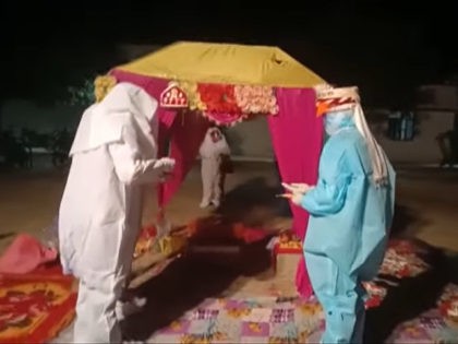 India: Couple Gets Married in PPE After Bride Tests Positive for Coronavirus