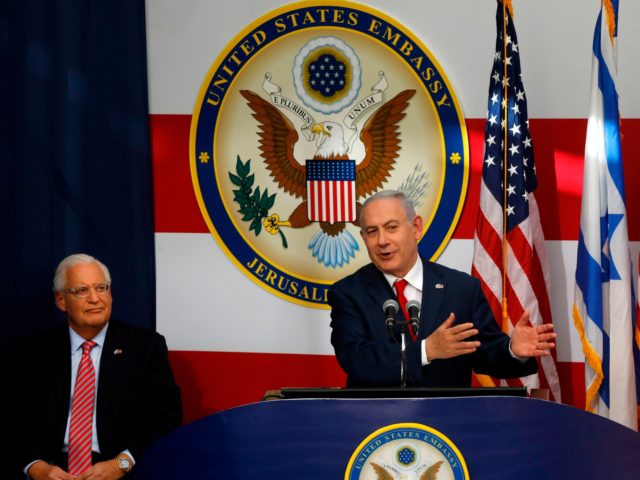 TOPSHOT - US ambassador to Israel David Friedman listens as Israel's Prime Minister Benjamin Netanyahu delivers a speech during the opening of the US embassy in Jerusalem on May 14, 2018. - The United States moved its embassy in Israel to Jerusalem after months of global outcry, Palestinian anger and …