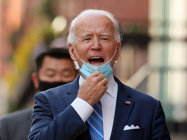 WILMINGTON, DELAWARE - DECEMBER 07: U.S. President-elect Joe Biden pulls down his face mask to tell reporters that he will announce his pick for secretary of the Department of Defense on Friday as he leaves the Queen Theater on December 07, 2020 in Wilmington, Delaware. Biden is expected to announce …