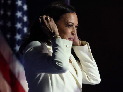 WILMINGTON, DELAWARE - NOVEMBER 07: Vice President-elect Kamala Harris takes the stage before President-elect Biden addresses the nation from the Chase Center November 07, 2020 in Wilmington, Delaware. After four days of counting the high volume of mail-in ballots in key battleground states due to the coronavirus pandemic, the race …